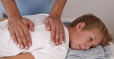 Young teen is treated by Edmonton Chiropractor