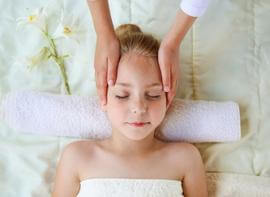 Registered massage therapist treat young child